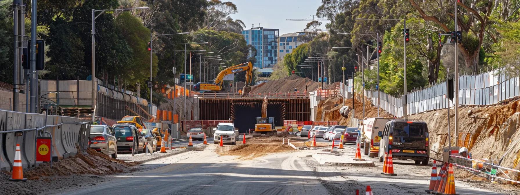 a dynamic urban construction scene in box hill showcases advanced under road boring machinery operating efficiently beneath the bustling street, highlighting the seamless integration of infrastructure development without disrupting the flow of traffic.